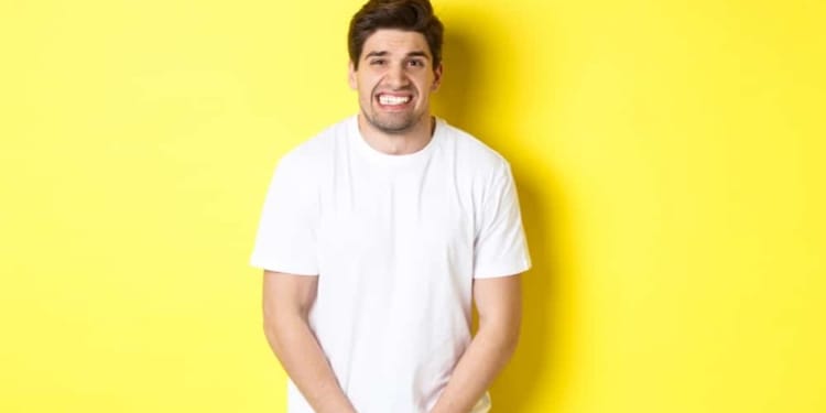 bladder problem man need toilet holding hands crotch grimacing urinal dysfunction copy space